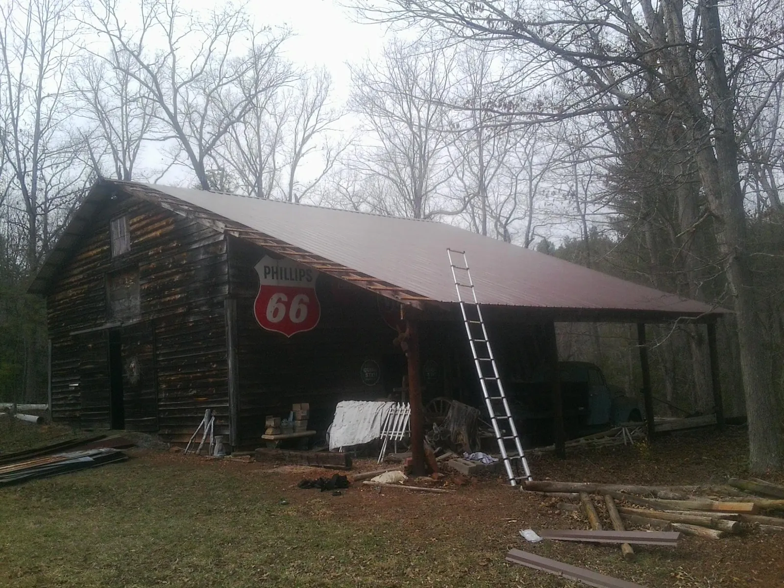 New metal roof on an open sided timber barn with a vintage sign in Atlantic Beach